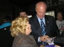 Fred gives an autograph in Davenport, Iowa, on the campaign trail.